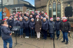 Theresa Villiers MP meets the Big Choir at the East Barnet Christmas Fair 2023