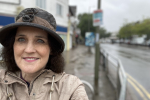 Theresa Villiers MP in the rain in New Barnet