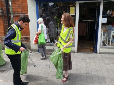 Theresa Villiers takes part in community litter-pick