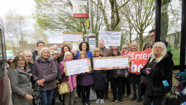 Theresa Villiers attends a protest to save the 84 bus